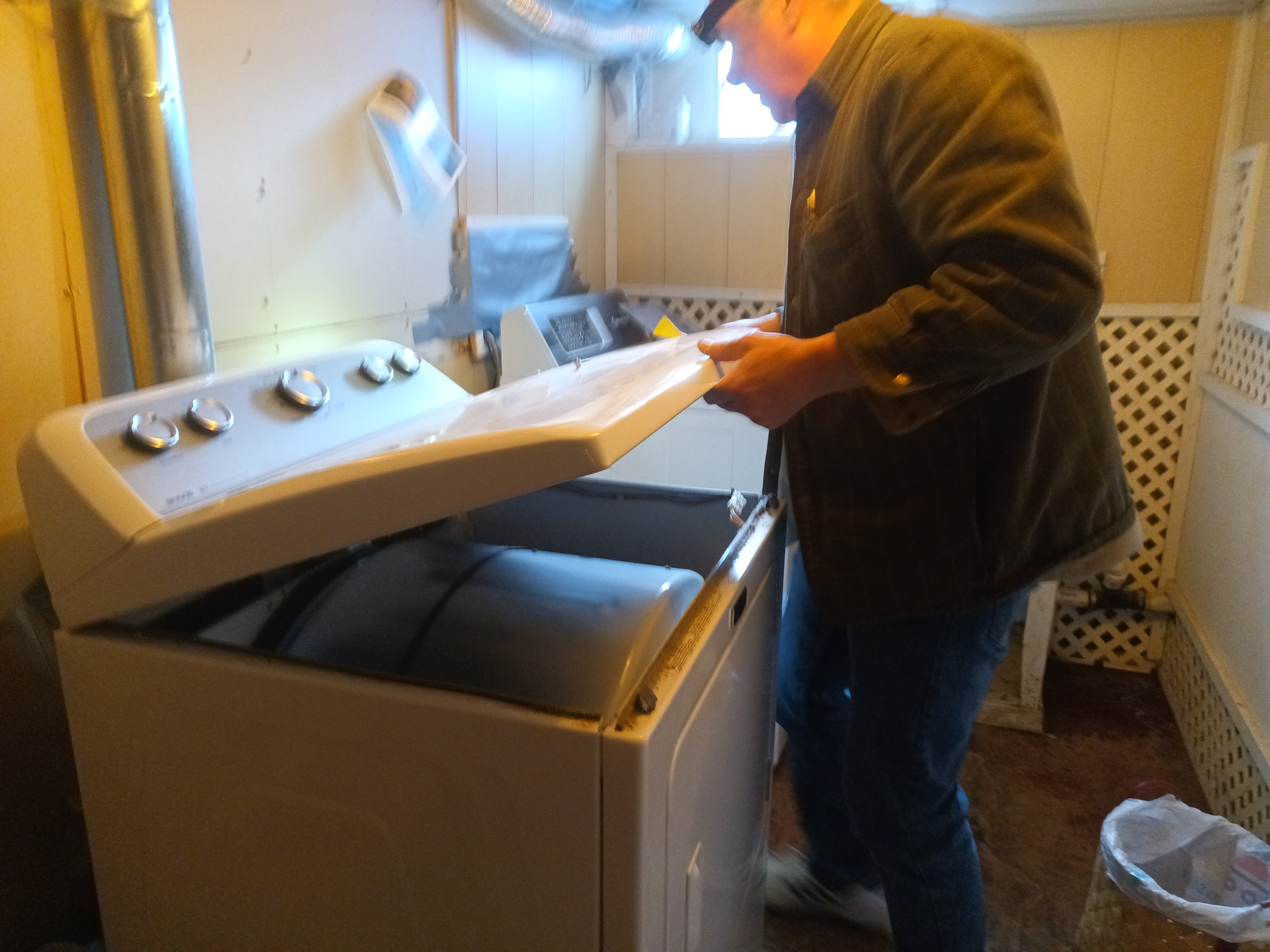 Technician repairing a washing machine